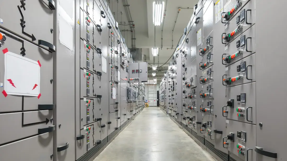 SMEC engineers assembling and wiring an industrial control panel in the fabrication facility